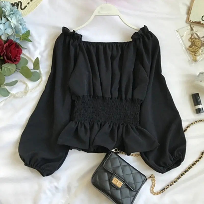 Virginia - Elegant off-shoulder blouse with ruffles